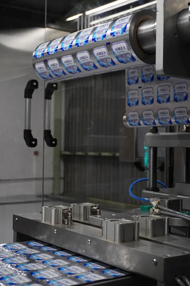 Automated cup-filling head on the Afriqua line